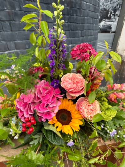 Country garden funeral posy 