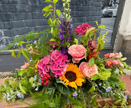 Country garden funeral posy 